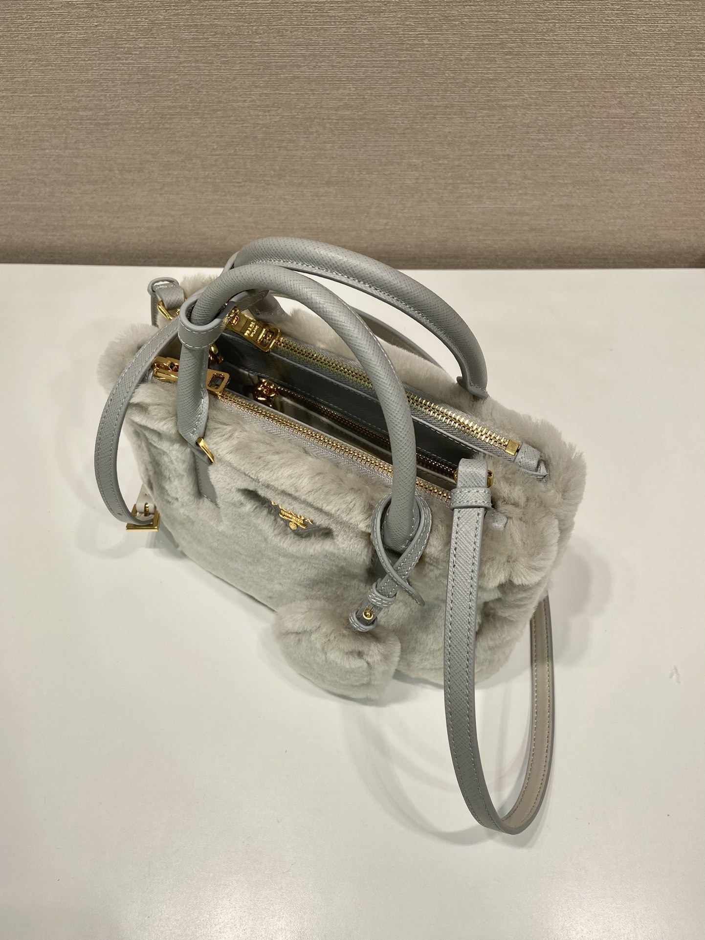 Pra*a galleria saffiano shearling top-handle bag
