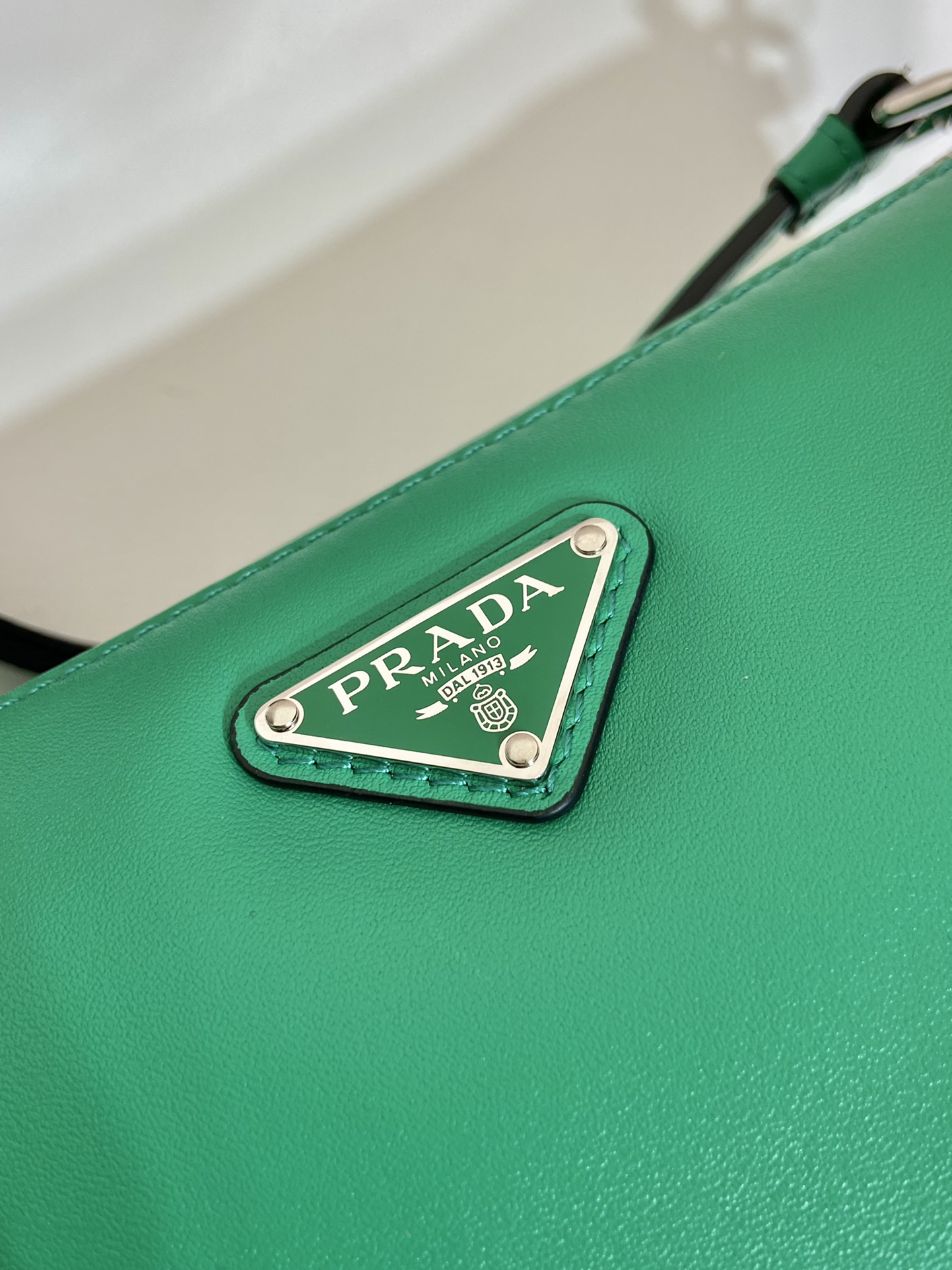 saffiano Pra*a triangle bag