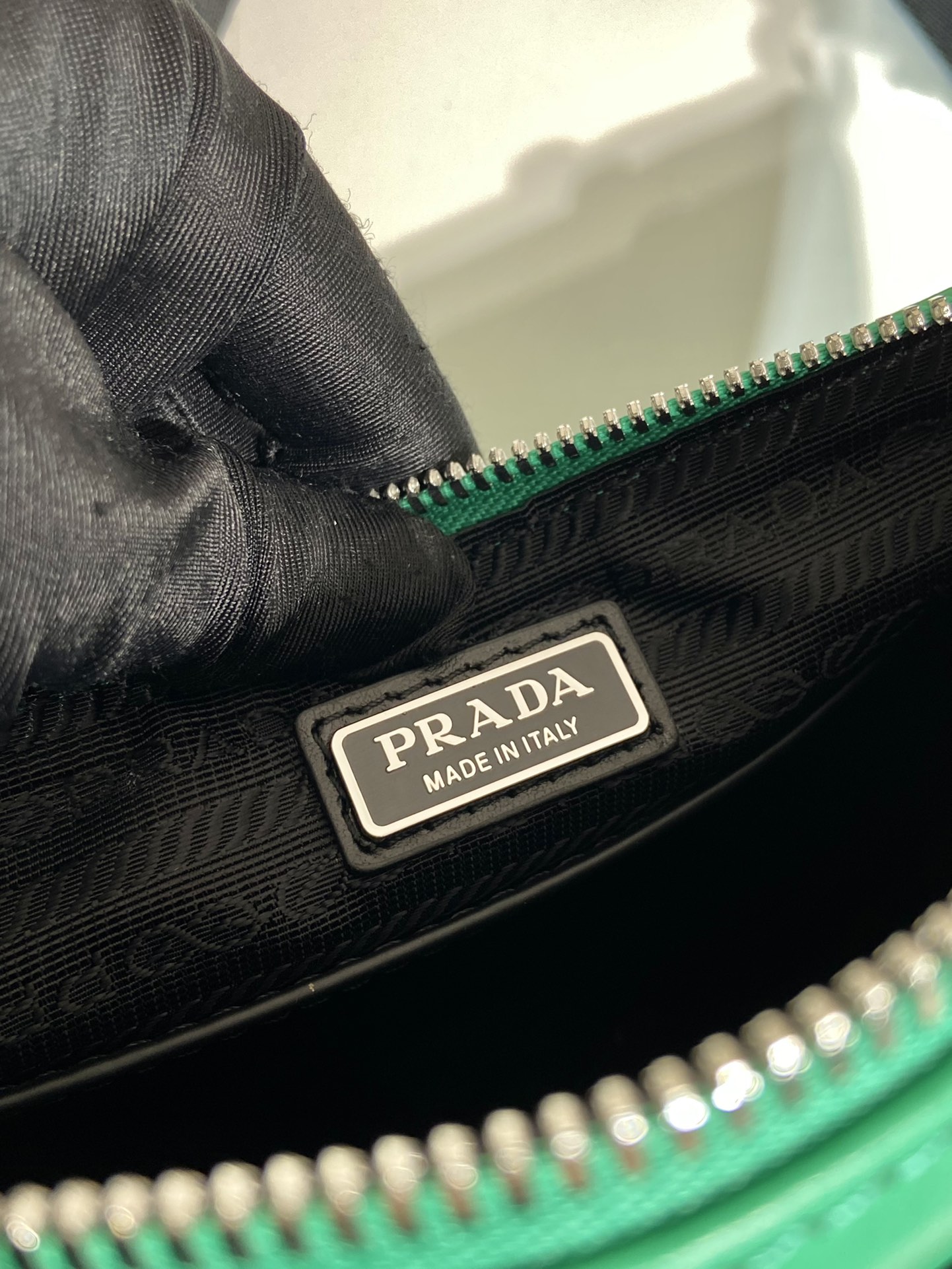 saffiano Pra*a triangle bag