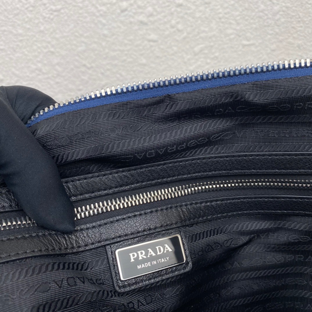 large leather Pra*a triangle bag