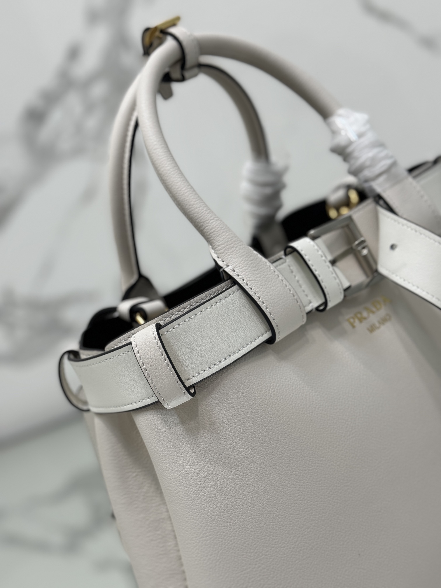 Pra*a buckle medium leather handbag with belt